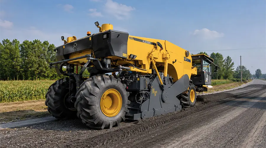 A yellow XCMG road cold recycler performing Cold In-Place Recycling (CIR) on a highway rehabilitation project to drastically reduce construction costs.