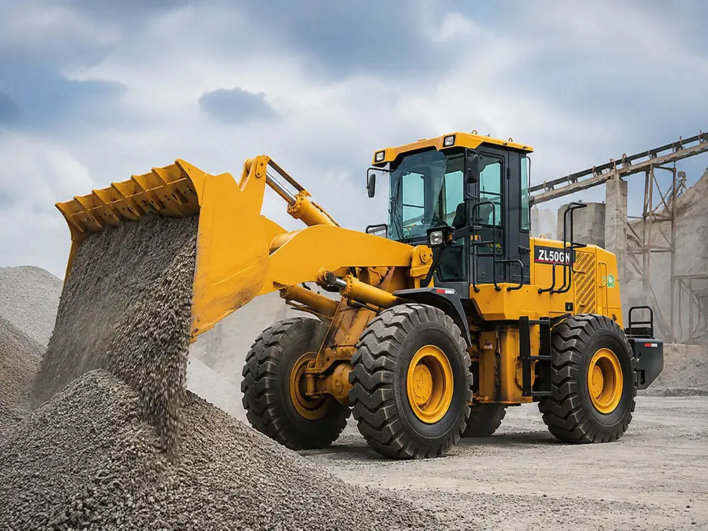 Close-up of XCMG ZL50GN wheel loader bucket dumping aggregate, illustrating efficient hydraulic cycle time and material handling capacity.